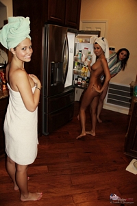 Naked friends in the kitchen