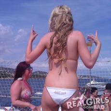 Blonde shows the rear of her bikini bottoms