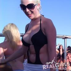 Blonde in shades, her boobs look like they want to come out