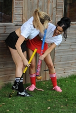 Girls fighting in their hockey kits