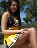 Cute Cheerleader in a Yellow Outfit