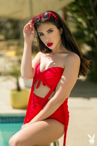 She's looking hot in shades by the pool