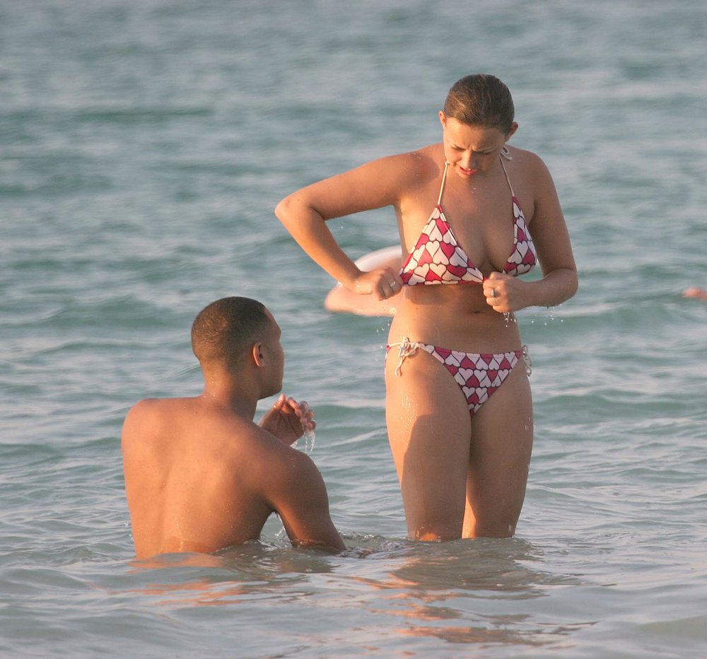 Adjusting her Bikini