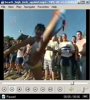 Video Download - TV Presenter Gives a Splendid High Kicking Upskirt on a Beach