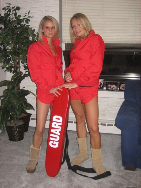 Two lifeguards with their board