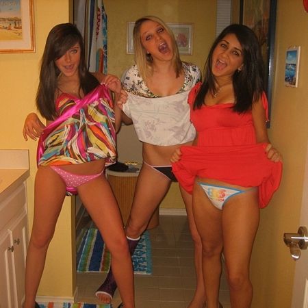 Fun Girls lift their skirts and show off their colorful panties