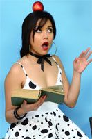 Petra is reading one of the classics when an apple falls down on her head