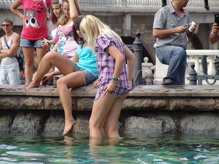 Blonde Lifts her Skirt in the Fountain
