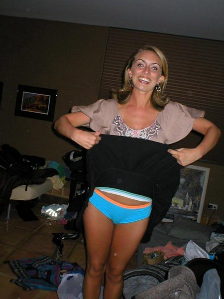 Lifting her Skirt to Show her Blue Panties