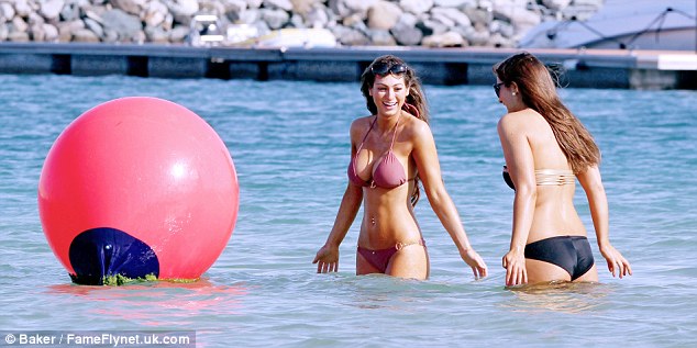 Two bikini girls go for a dip in their bikini