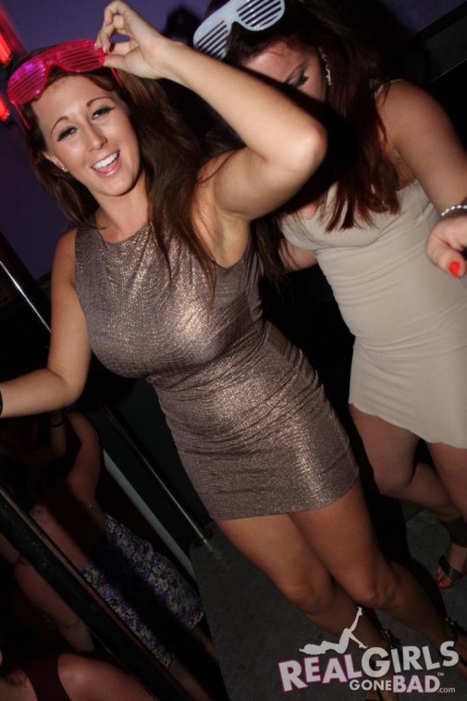 Busty British Brunette Smiles in a Club