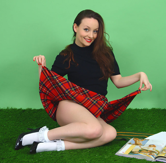 Carla lifts up her skirt to tease you as she reads a magazine