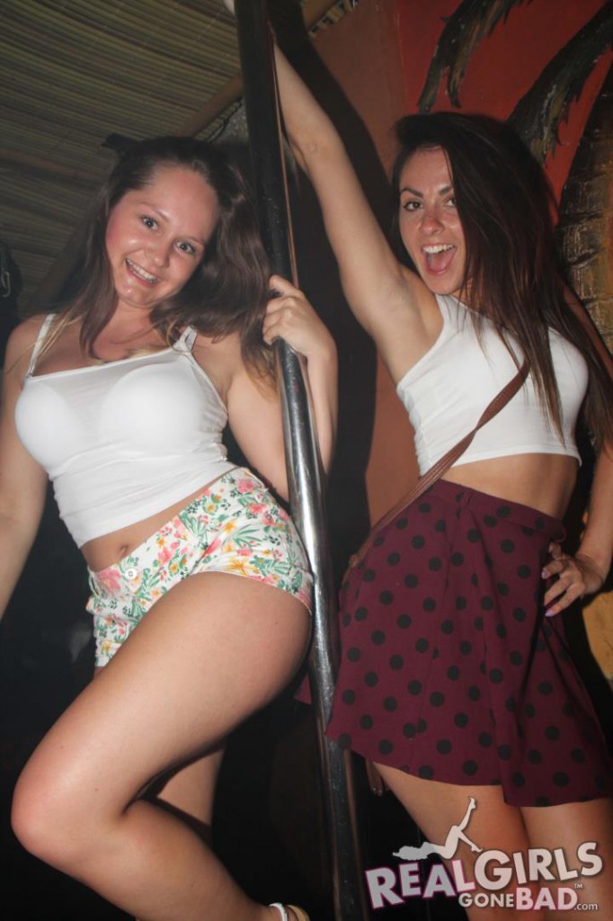 Real girls dance around a pole on a pub crawl