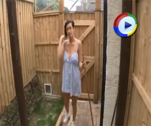 Kim Shows Downblouse as she Sweeps Up Outdoors on DownblouseLoving
