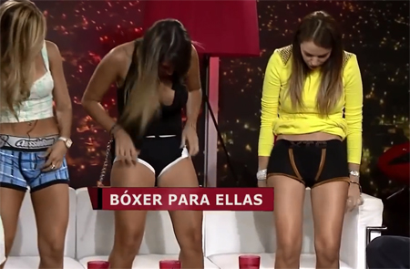 Sexy girls lift up their skirts on TV for a bit of fun