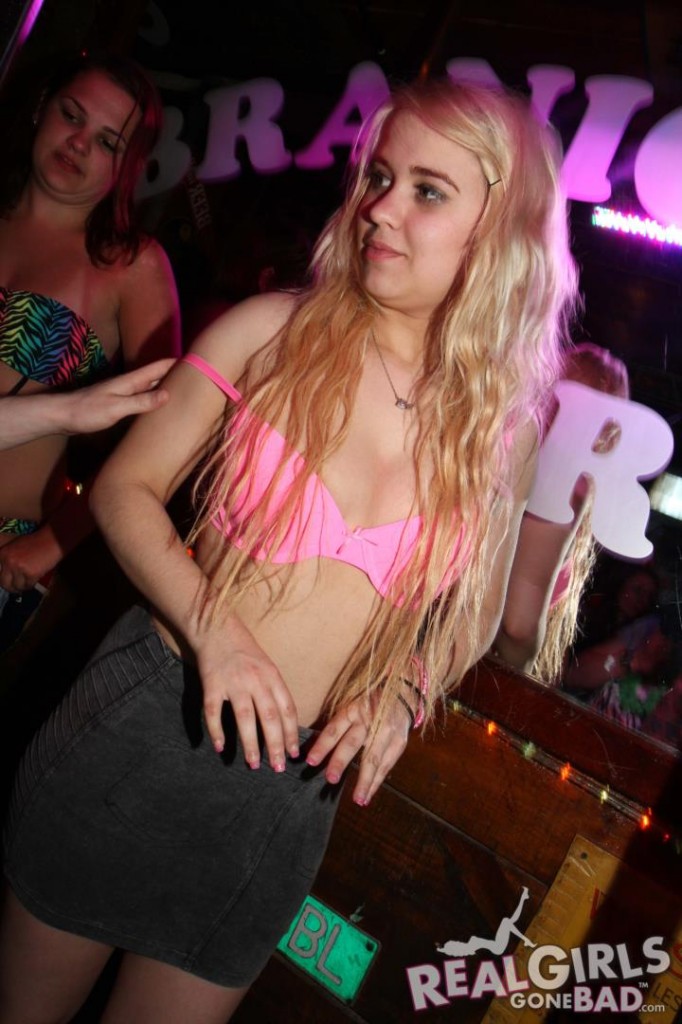 Cute blonde British girl in a pink bra