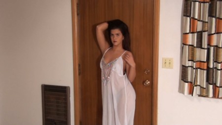 Maria poses in a white dress on Northwest Beauties