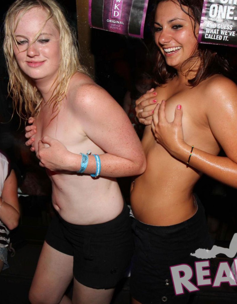 Drunk party girls showing off in handbras