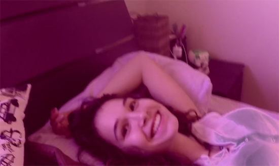 Cute brunette girl on her bed