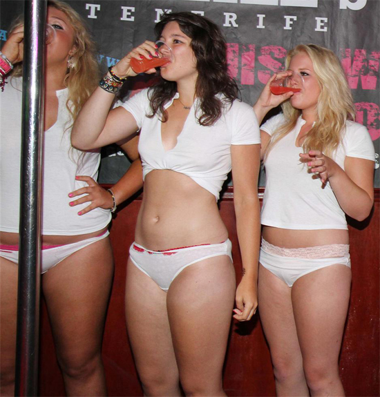 British Party girls on stage for a wet t-shirt contest in O'Neill's Bar, Tenerife