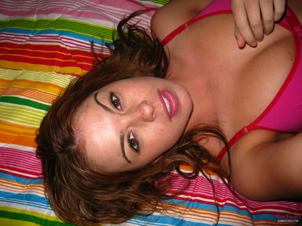 Kari Sweets on her bed in bra and panties