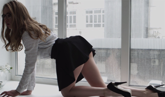 Teasing by the window in heels
