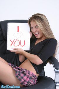 Adoring Kari holds up an I love you sign