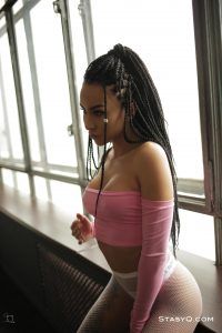 Petite hottie TequilaQ looking sexy as she poses by the window for StasyQ