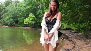Beautiful Bailey Knox standing by the lake and showing a nice bit of cleavage