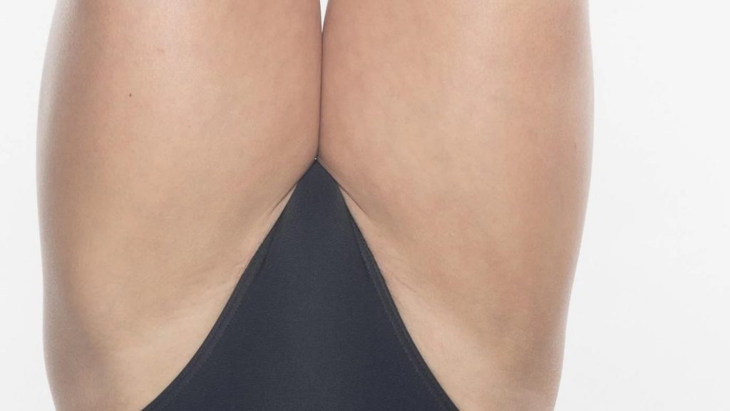 Zooming in on her the crotch of her swimsuit, a closeup