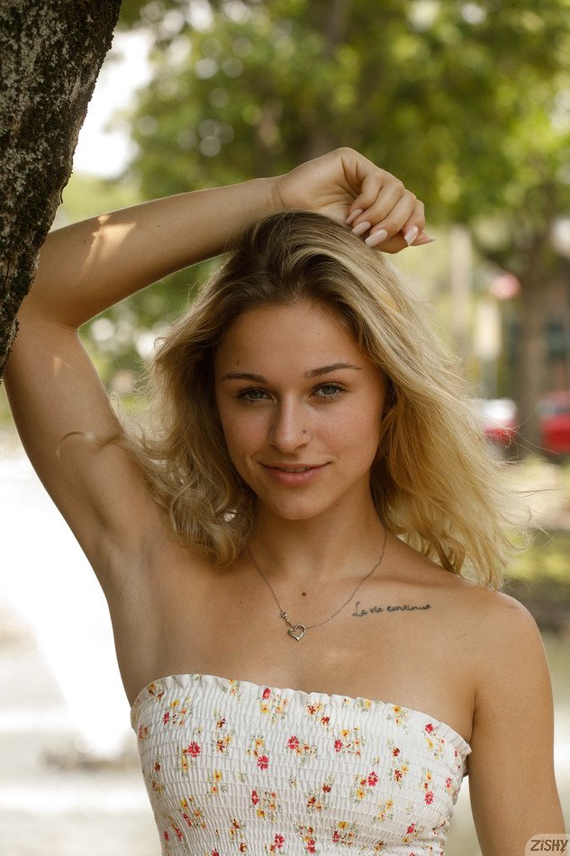 Blonde coed Jezebel poses outdoors for Zishy