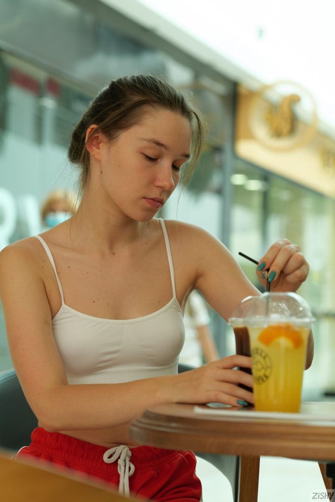 Cute brunette girl in red shorts