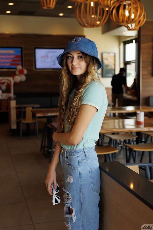 Skyla Kirch poses for Zishy in jeans and a bucket hat